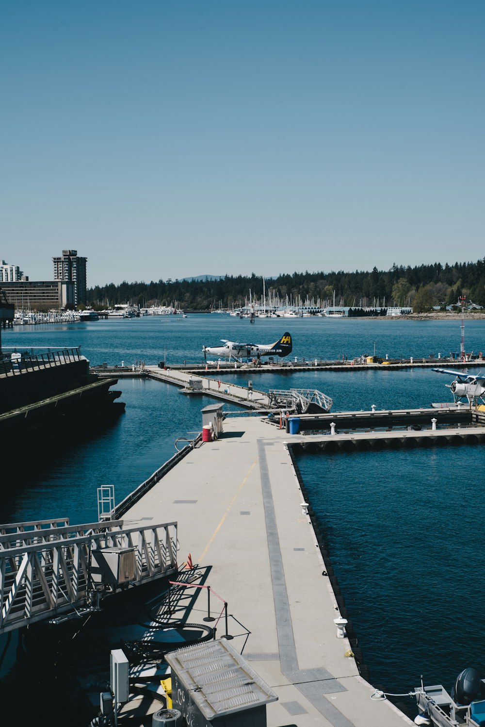 a harbor with boats docked and a ramp leading to a dock