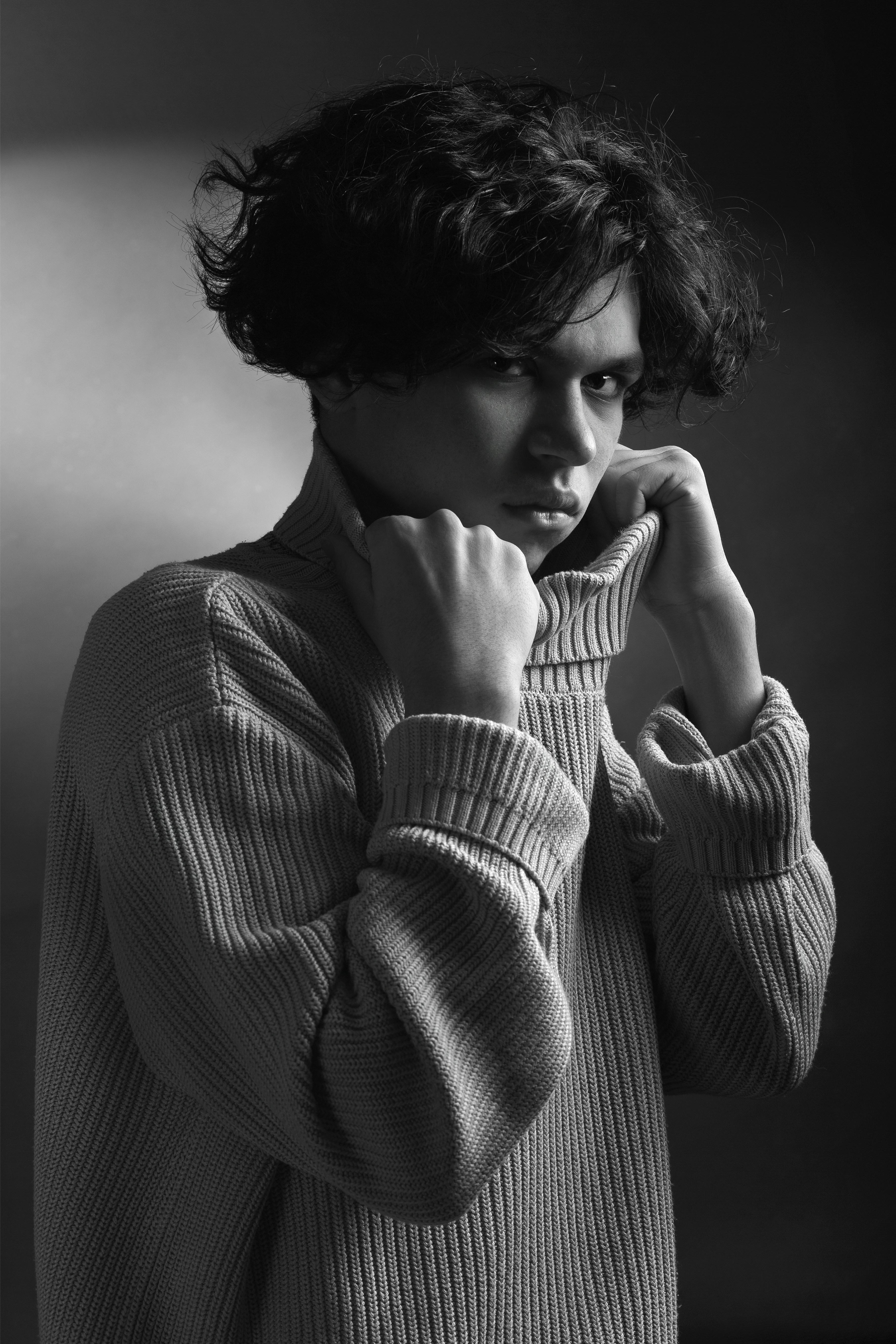 A curated set of elegant accessories including a watch, a scarf, and a pair of sunglasses