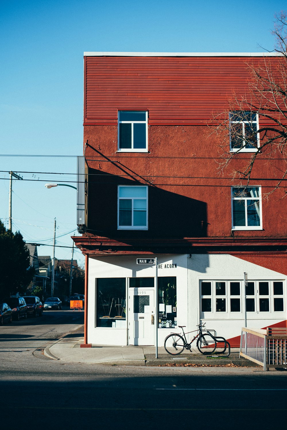 a bike parked in front of a red building