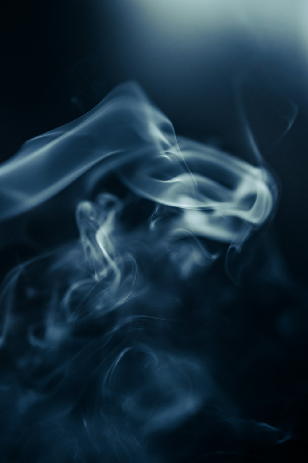 a blue smoke texture on a black background