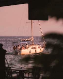 a boat with people on it in the water