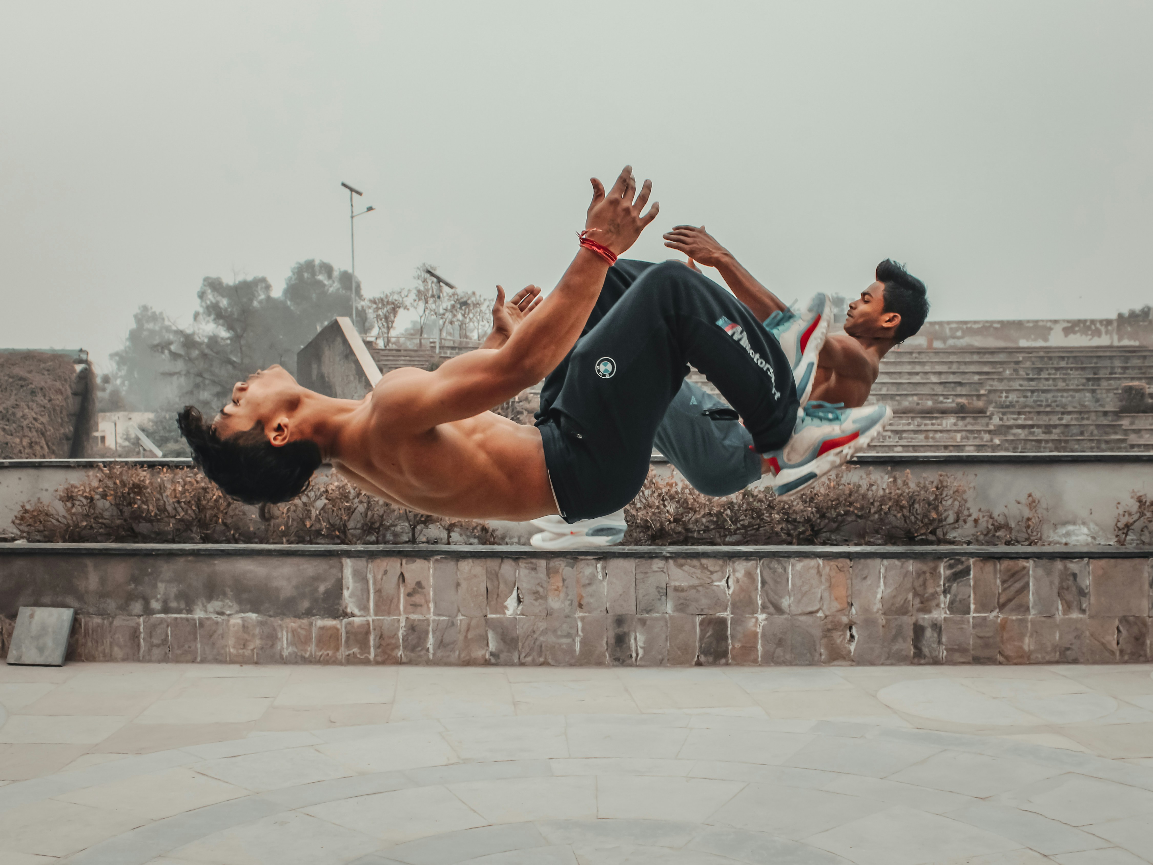 a man doing a trick on a skateboard in the air