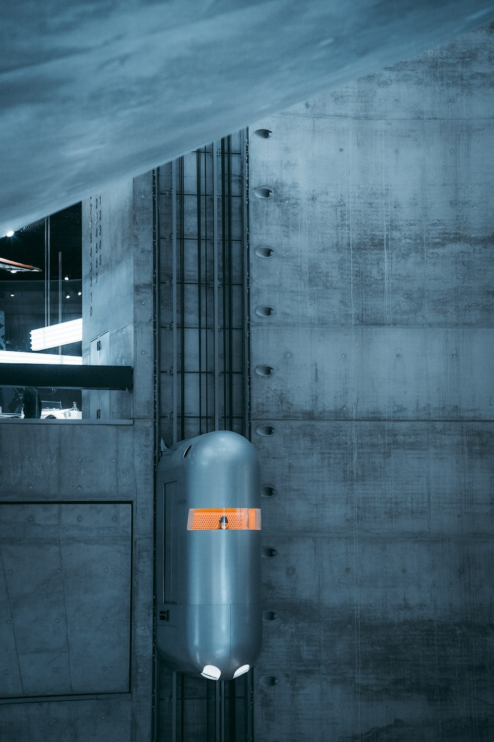 a large metal object in a dimly lit room