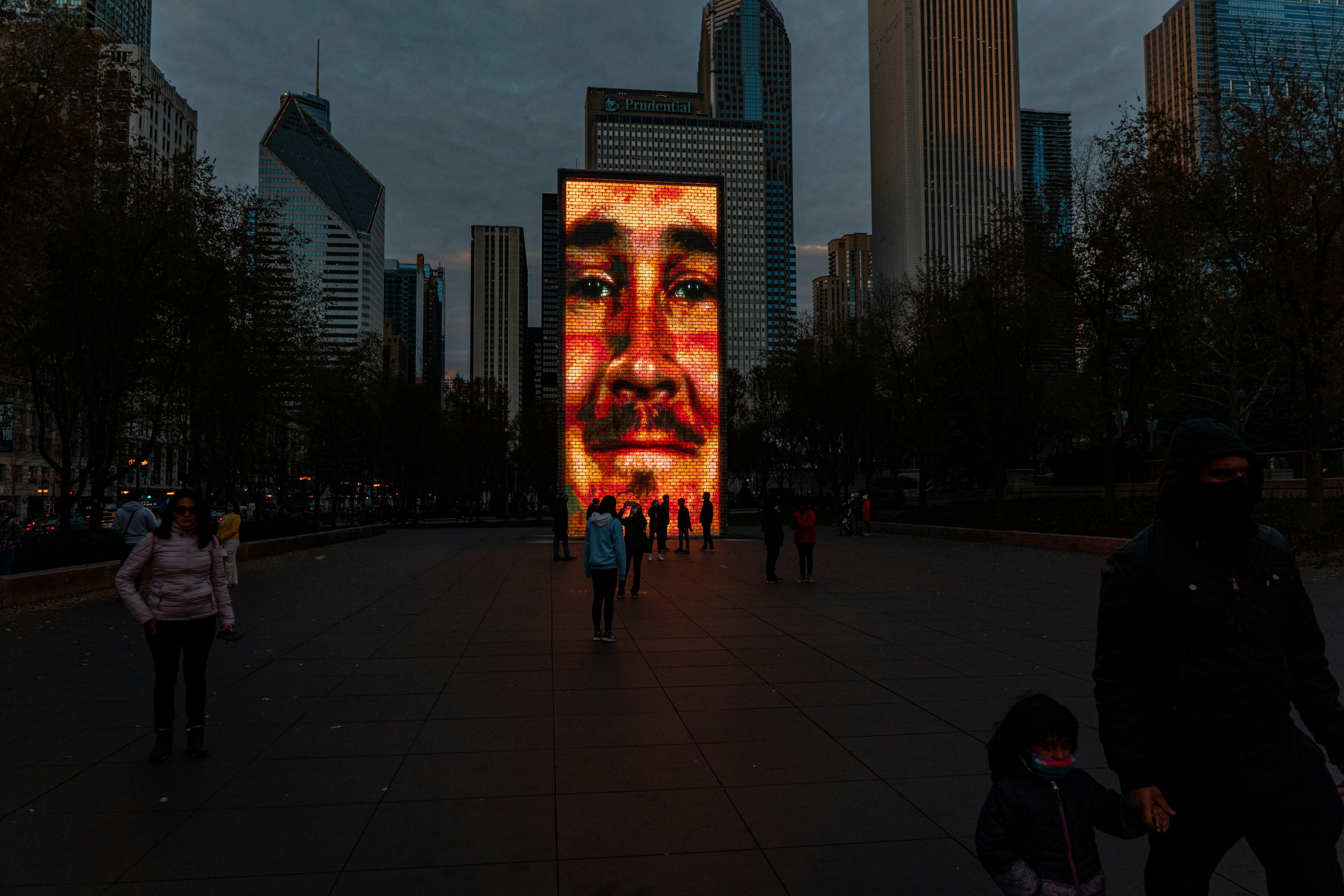 a large painting of a man's face on the side of a building