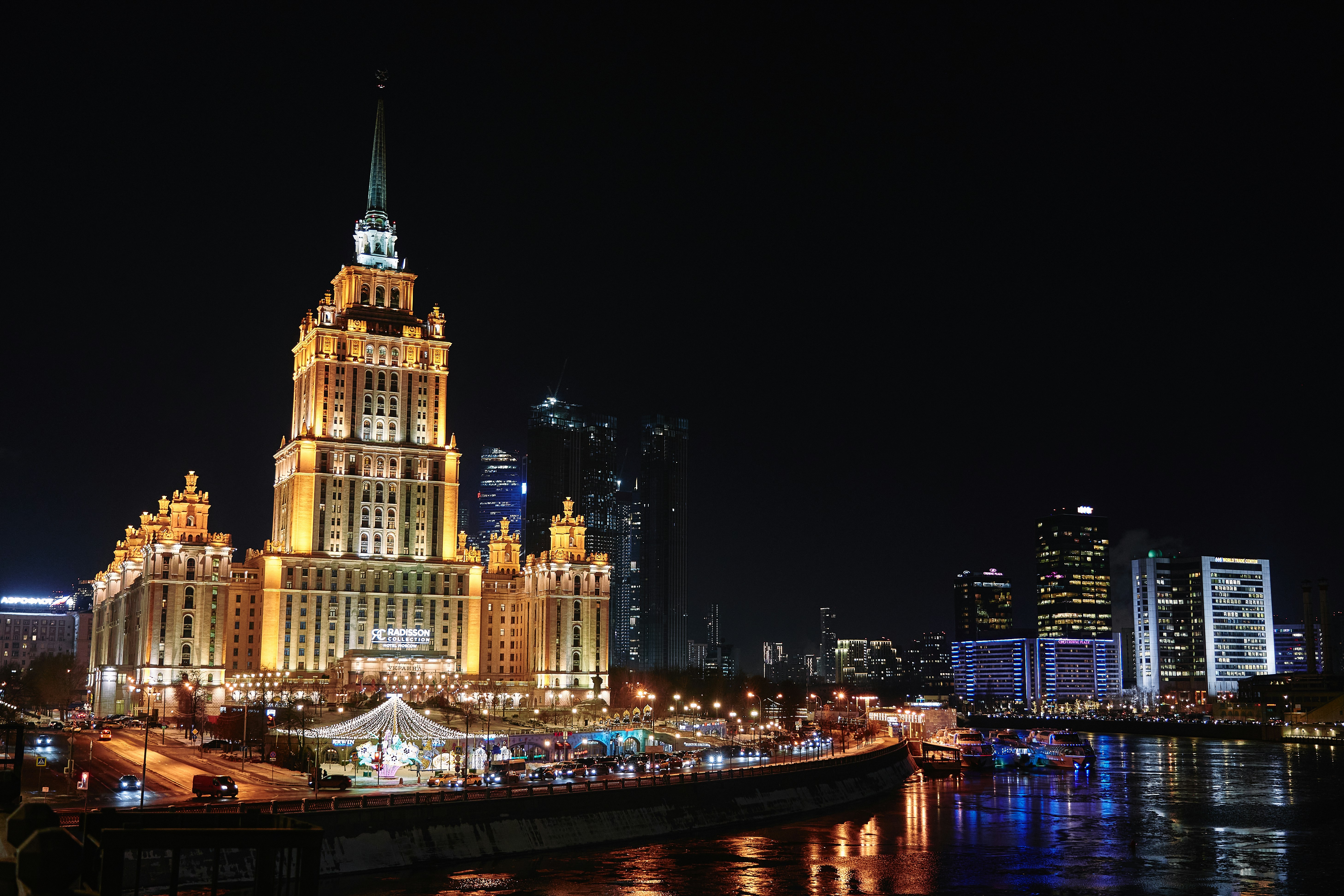 a very tall building with a clock tower at night