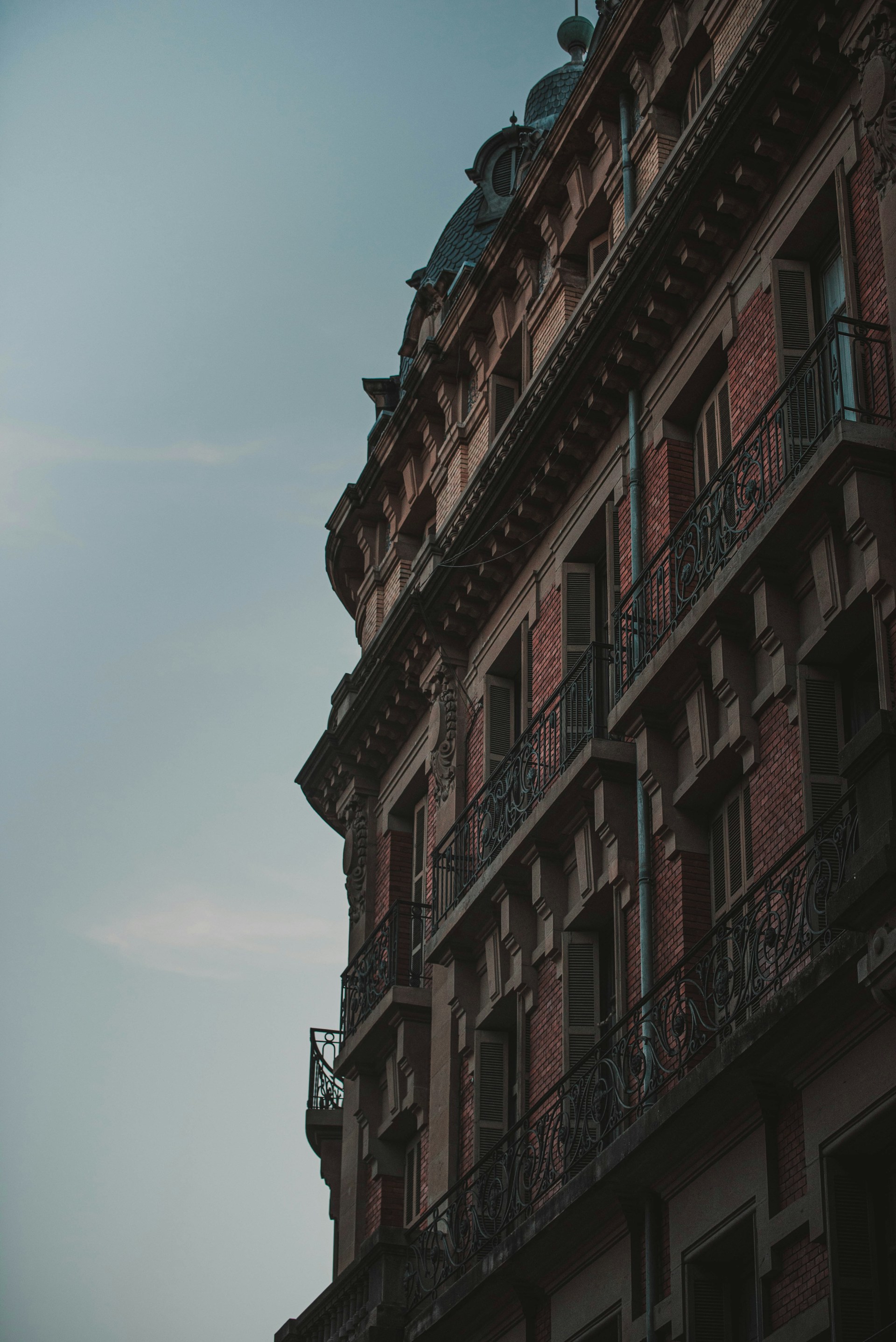 a tall building with a clock on the top of it