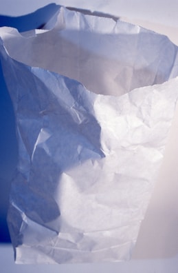 Bottom view of a sos paper bag showing the folded base for stability.