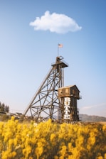 a tall tower with a flag on top of it