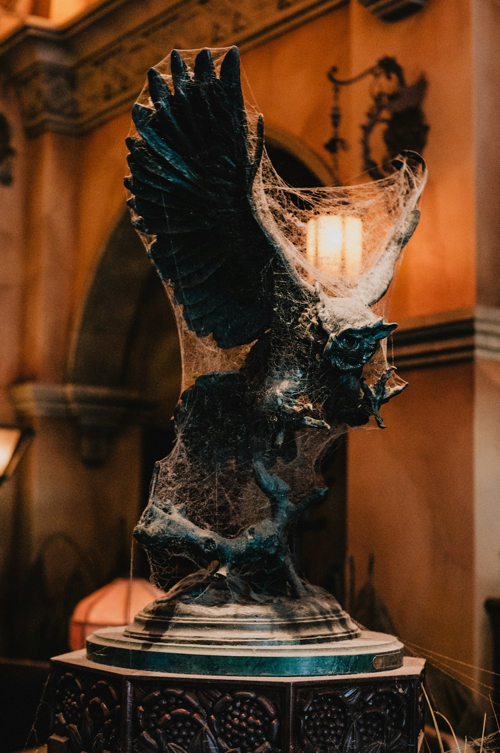 a statue of an eagle on a pedestal