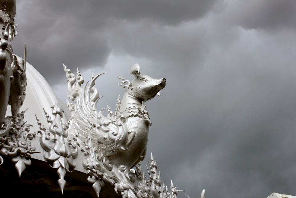 a statue of a dog on top of a building