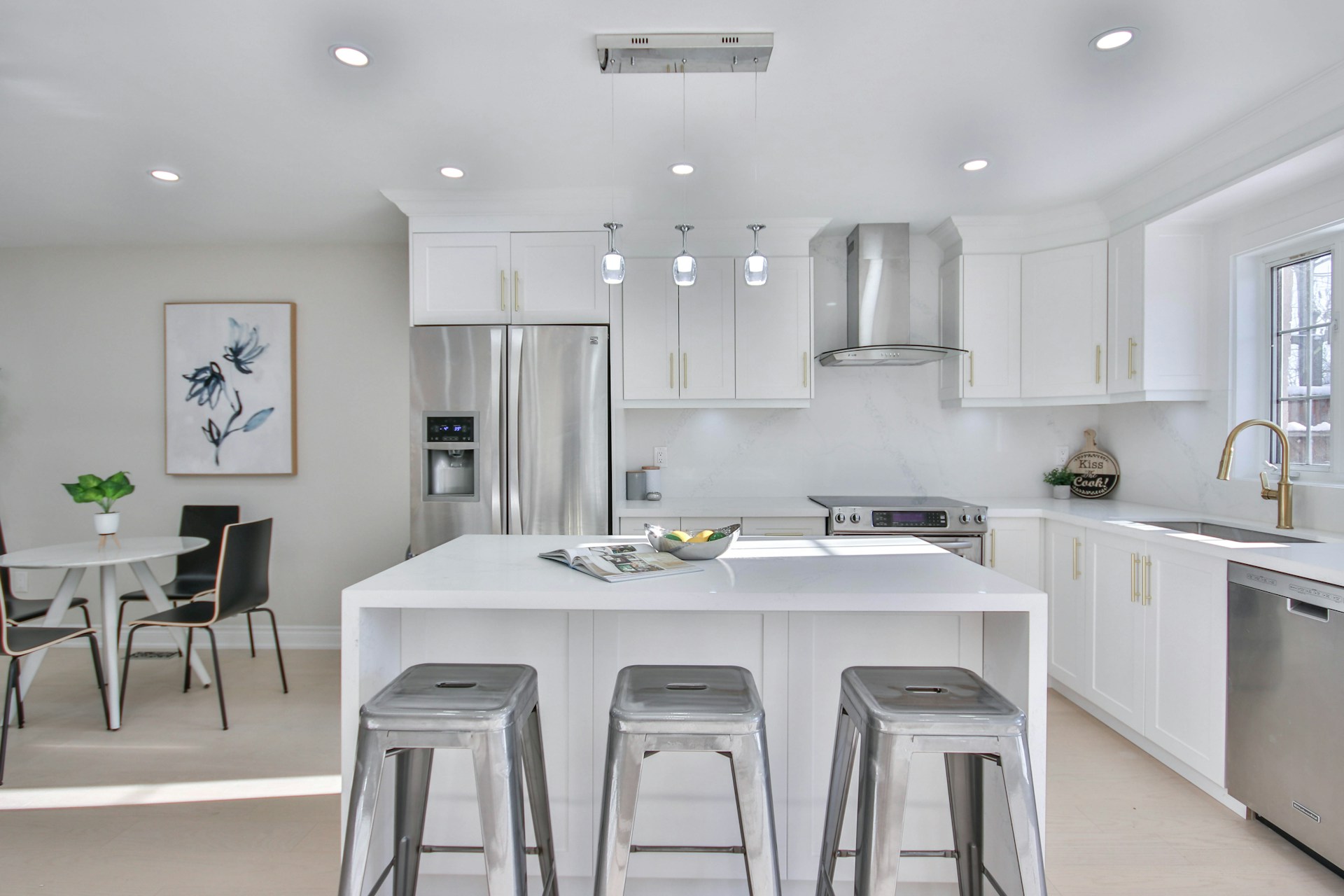 a kitchen with a center island with stools