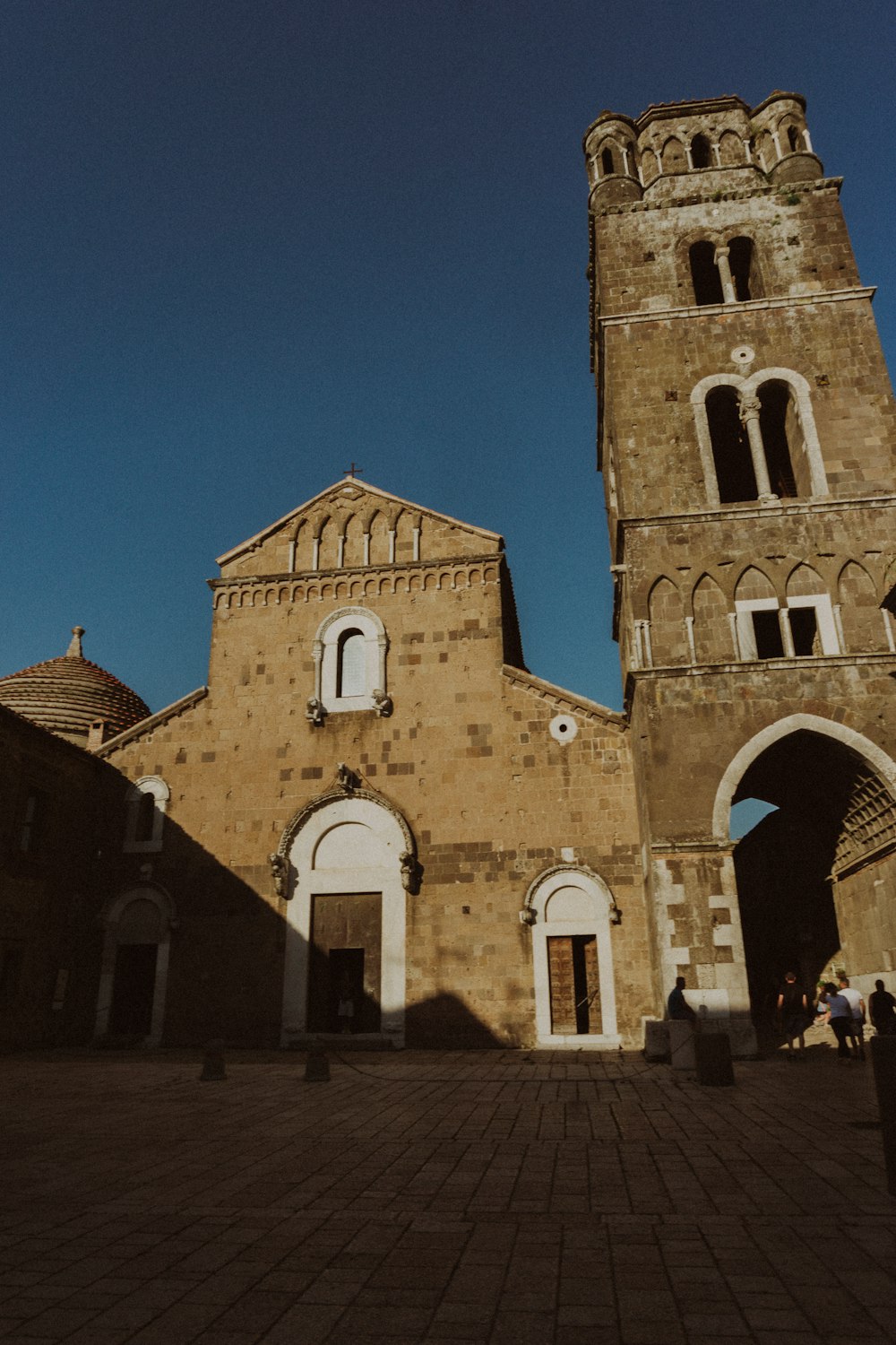 an old church with a clock tower in the background