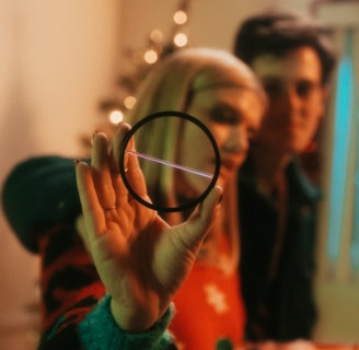 a woman holding a magnifying glass in front of her face