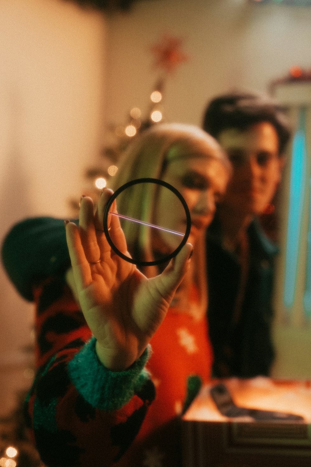 a woman holding a magnifying glass in front of her face