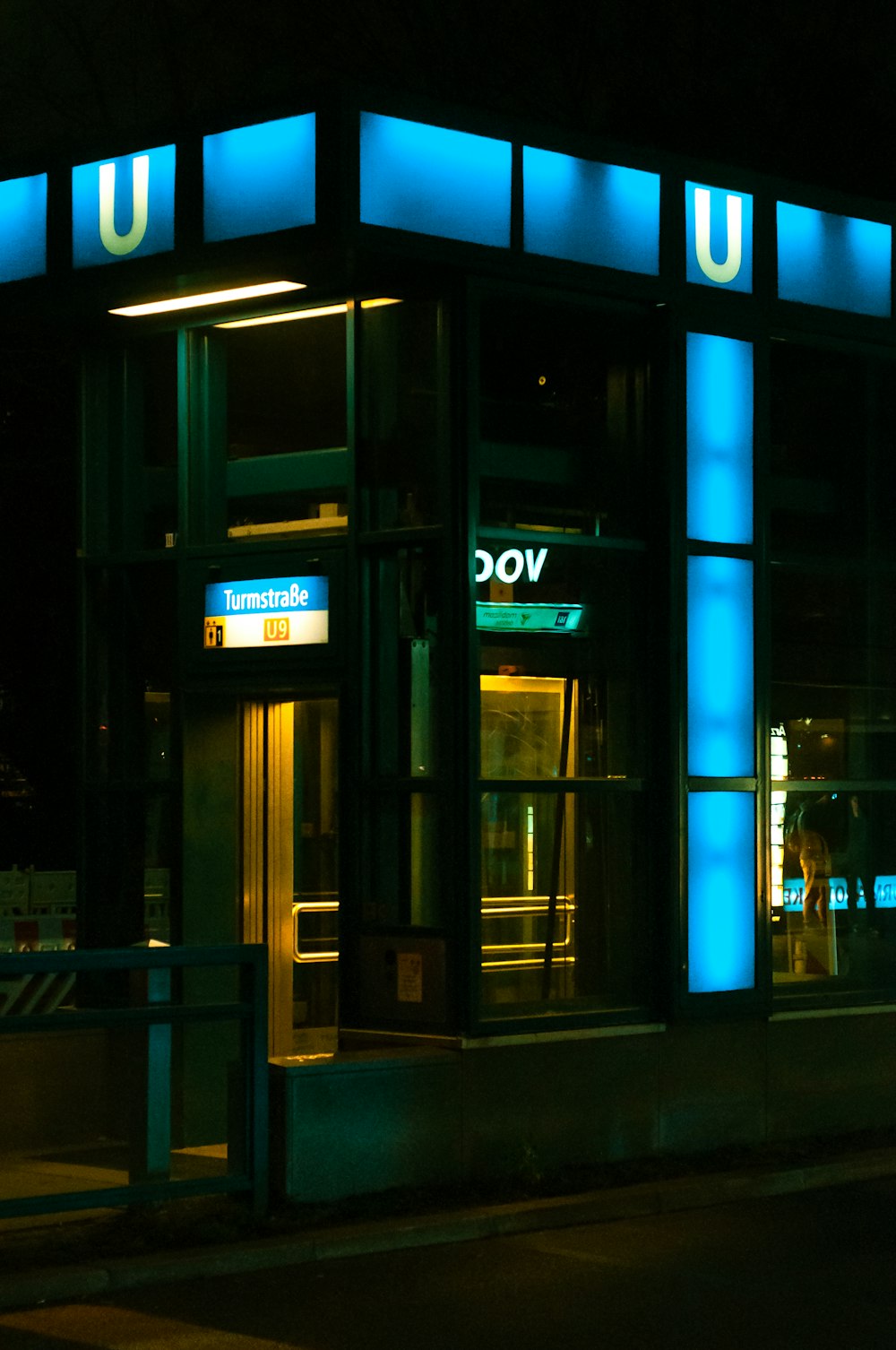 a lit up building at night with blue lights