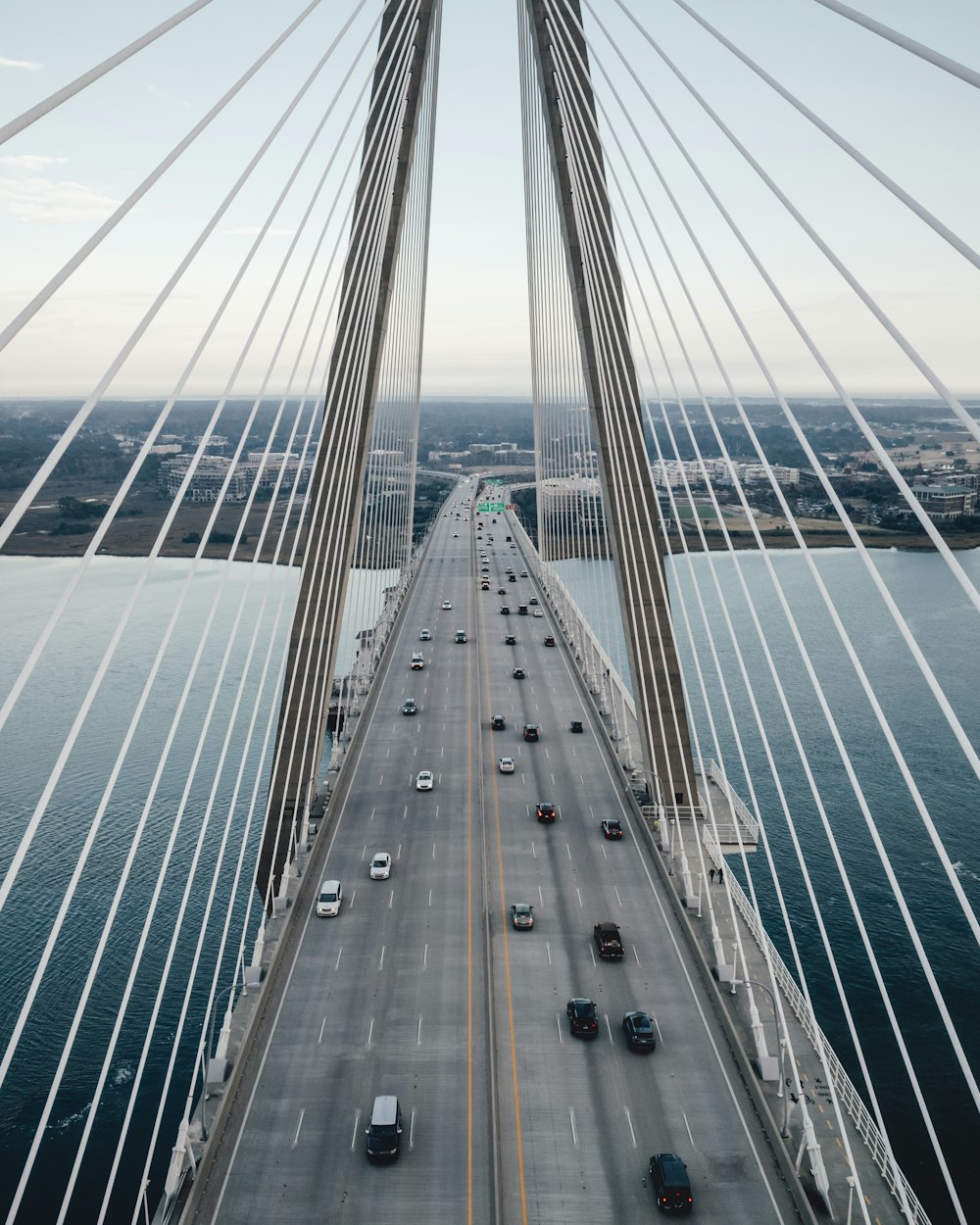 a view of a bridge with cars going over it