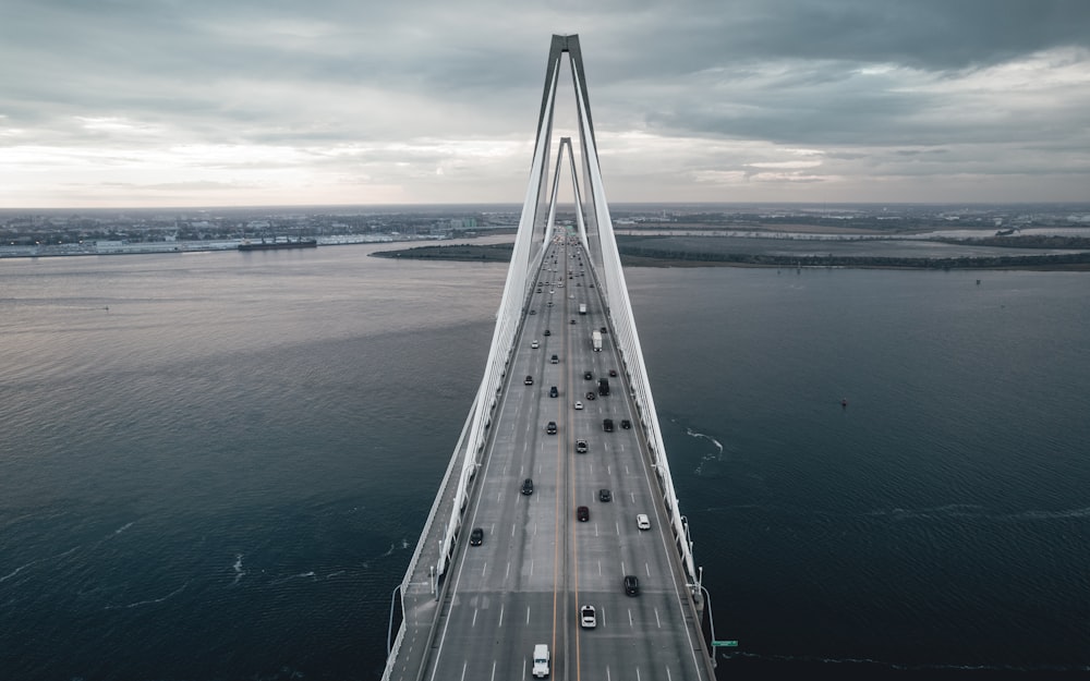 an aerial view of a bridge over a body of water