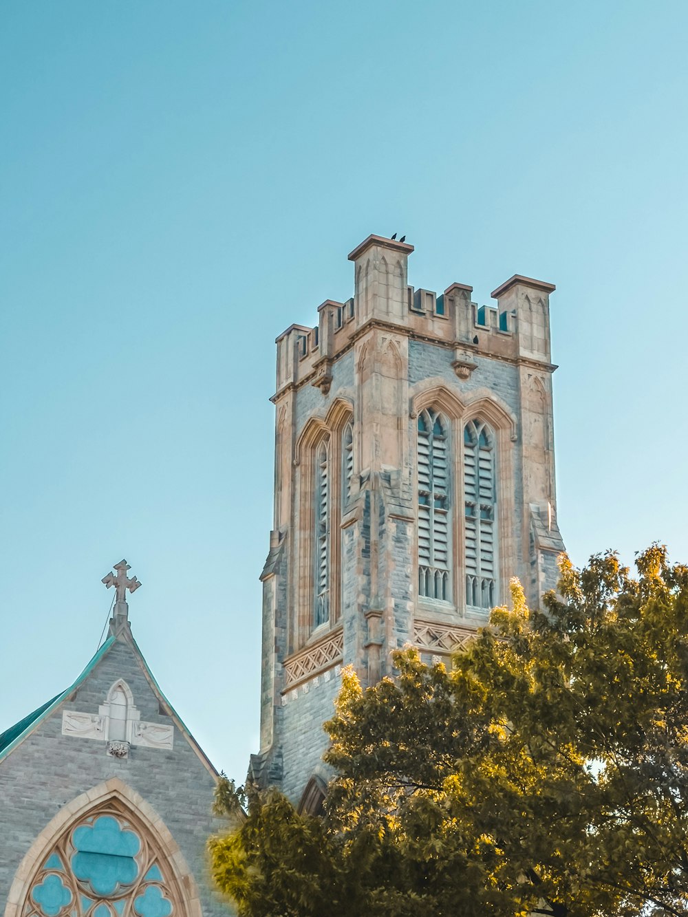 a church steeple with a blue sky in the background