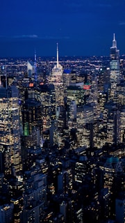 An aerial view of a beautiful city skyline at night.