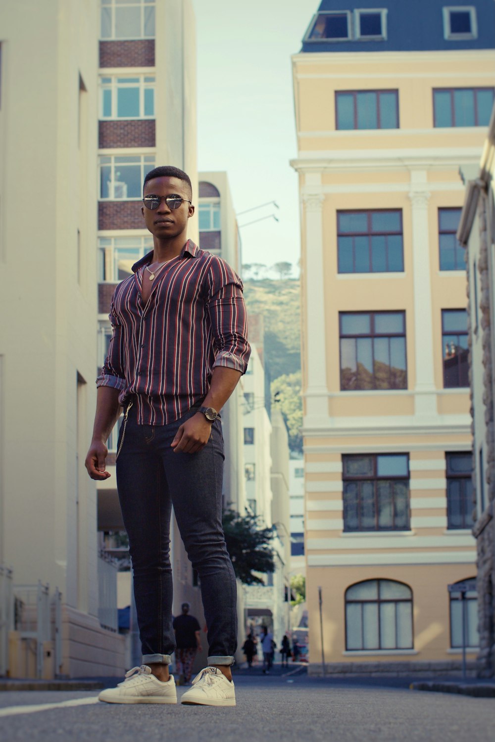 a man standing in the middle of a street