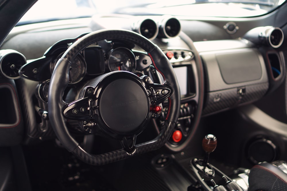 a close up of a steering wheel and dashboard of a car