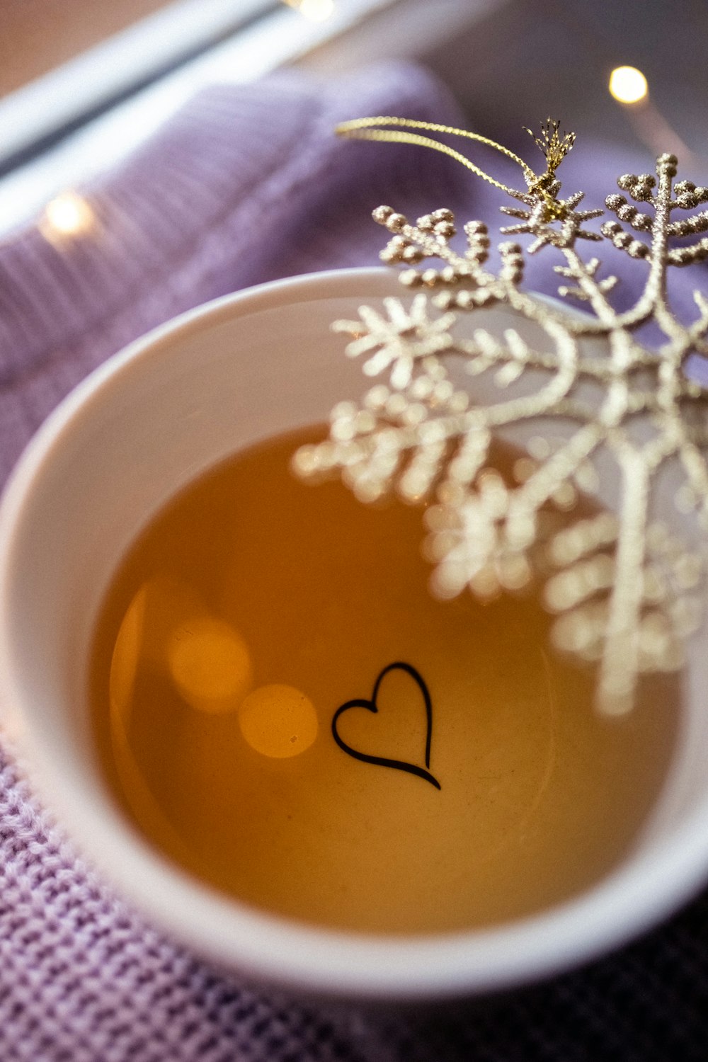 a cup of tea with a heart drawn on it