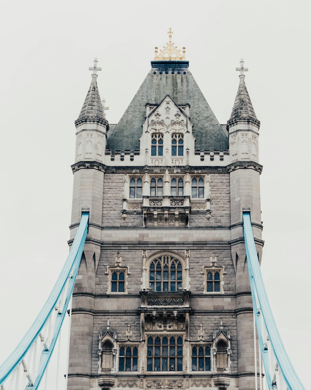 a very tall tower with a clock on it's side