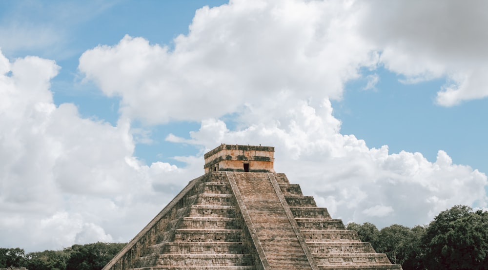 a large pyramid in the middle of a field