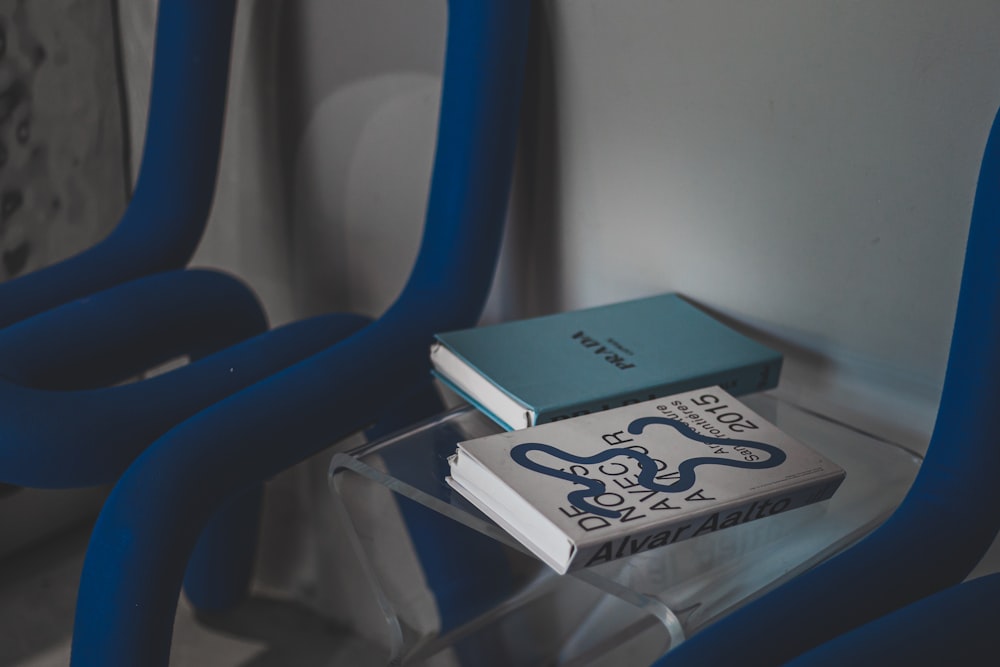 a book sitting on top of a glass table