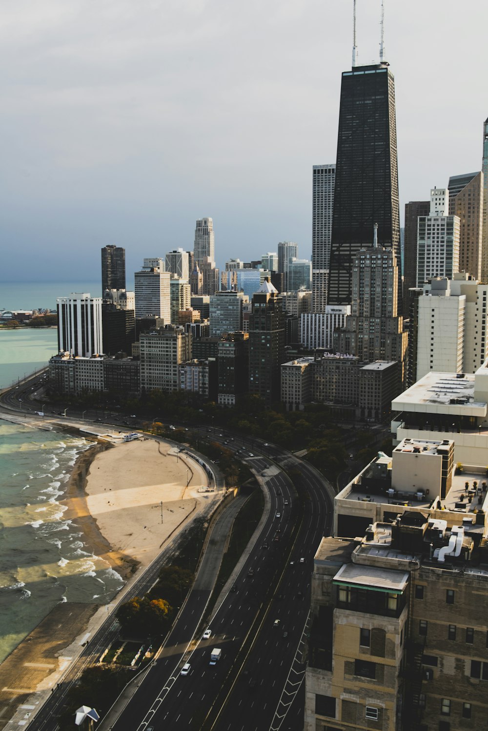 an aerial view of a city and the ocean