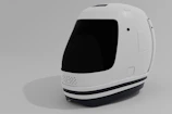 A sleek tactical helmet featuring rounded corners and cinematic lighting.