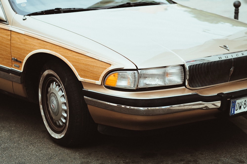 a close up of a car parked on the street