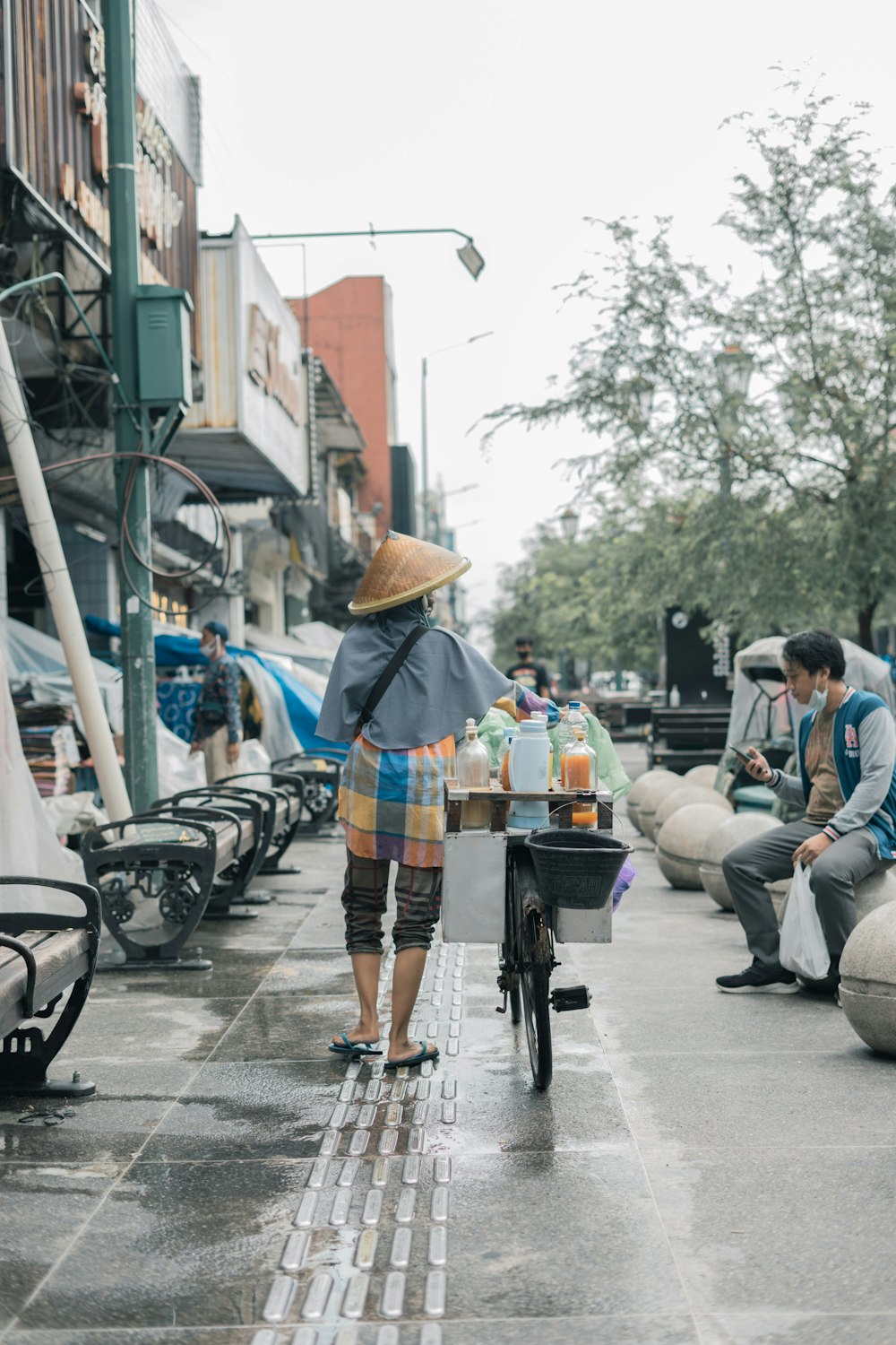 a person riding a bike down a street