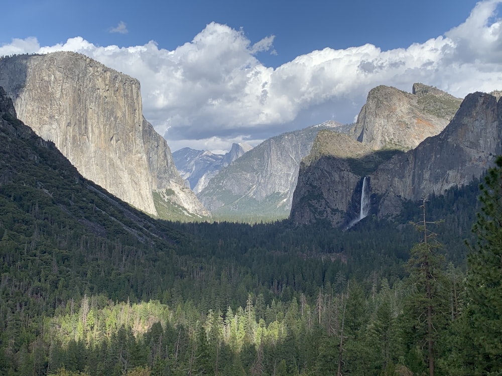 a view of a valley with mountains in the background