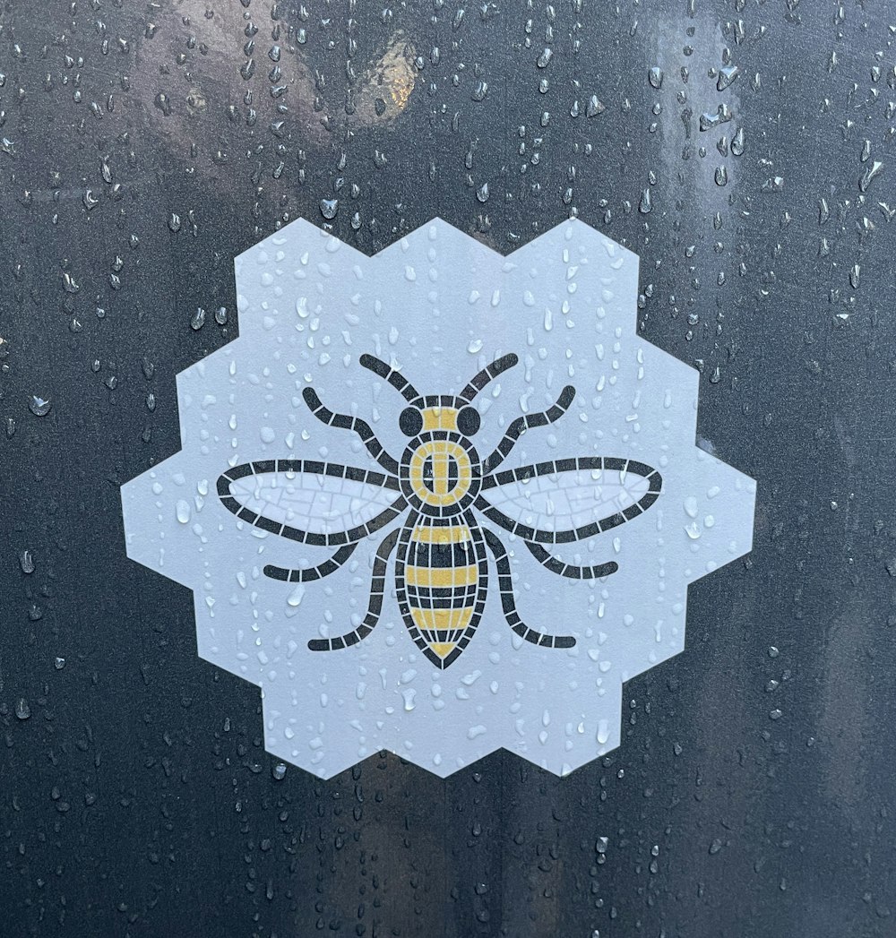 a sticker of a bee on a window