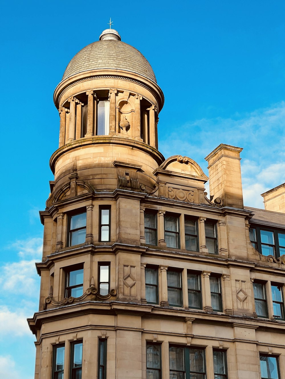 a tall building with a clock on the top of it