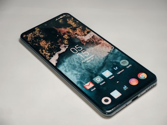 a close up of a cell phone on a table