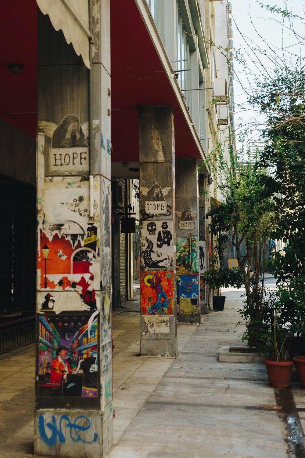 a building with graffiti on the side of the street