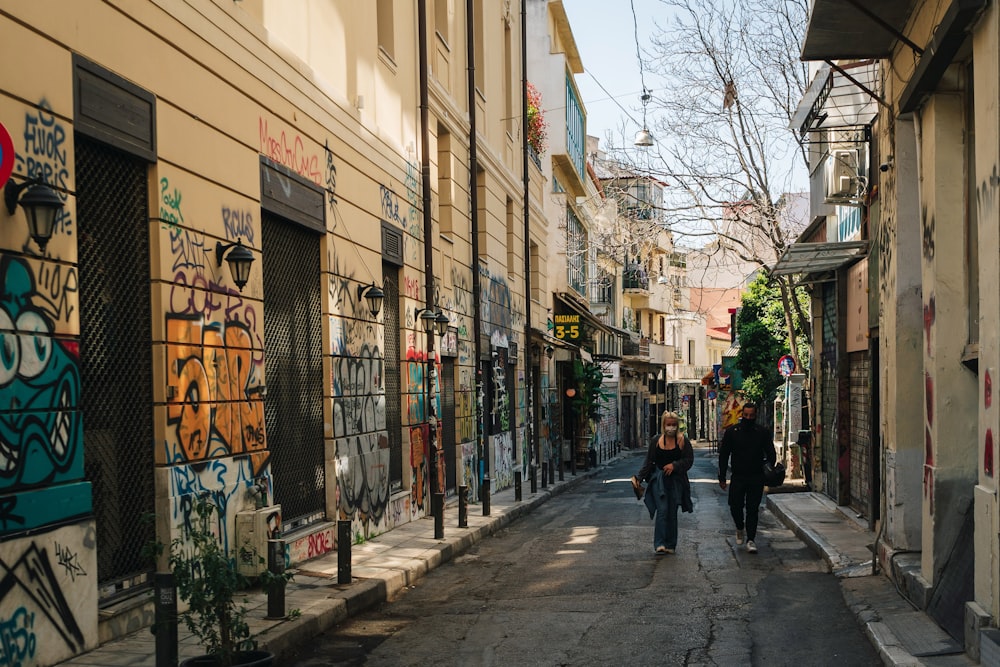 a group of people walking on a city street