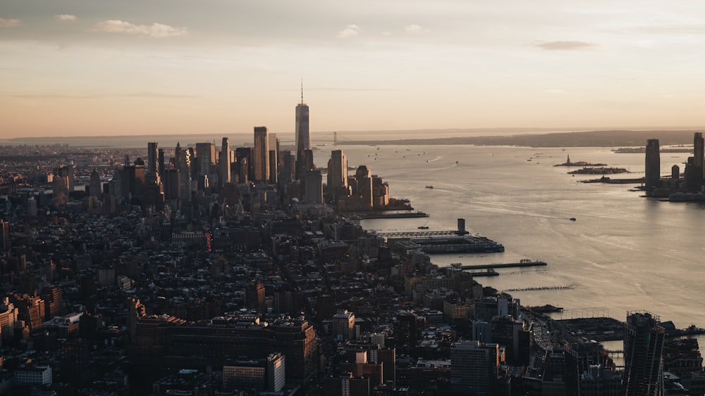 an aerial view of a large city and a body of water