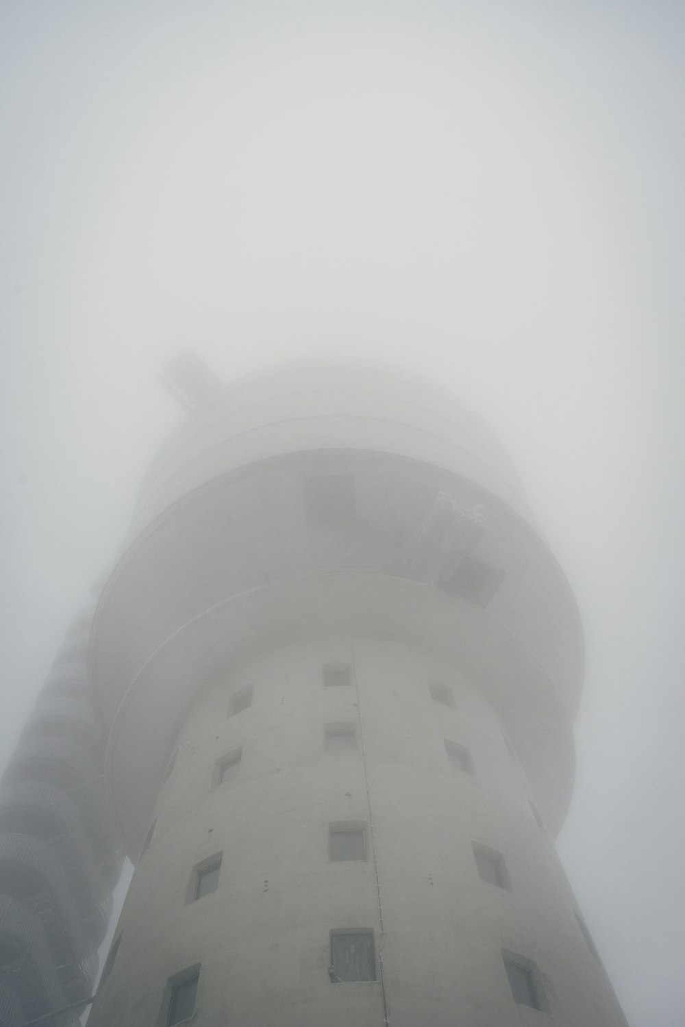 a very tall building with a clock on it's side