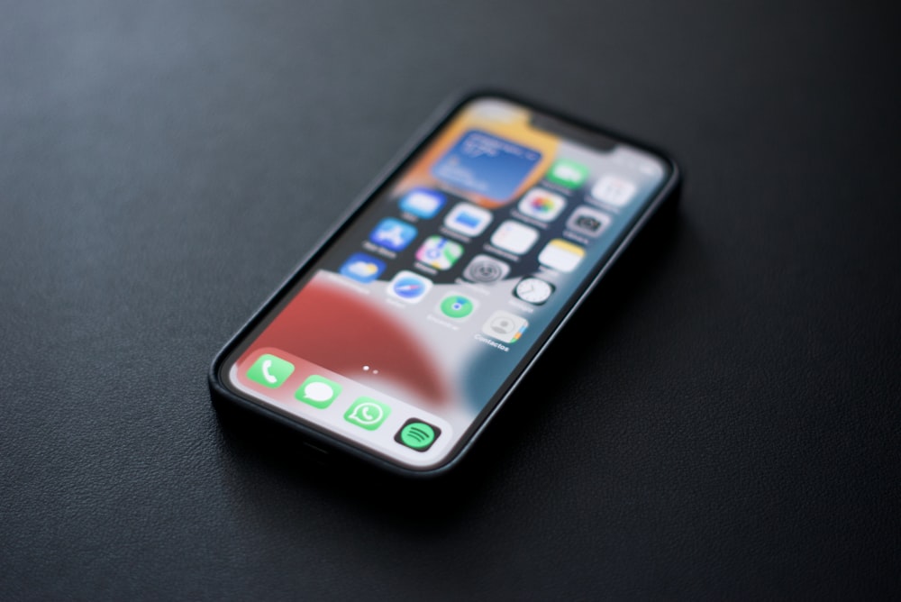 a close up of a cell phone on a table