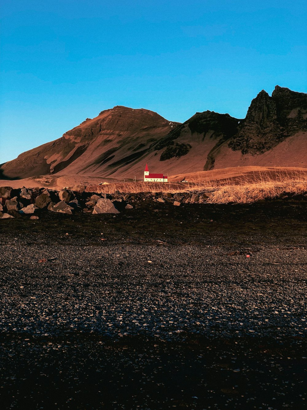 a small house in the middle of a desert