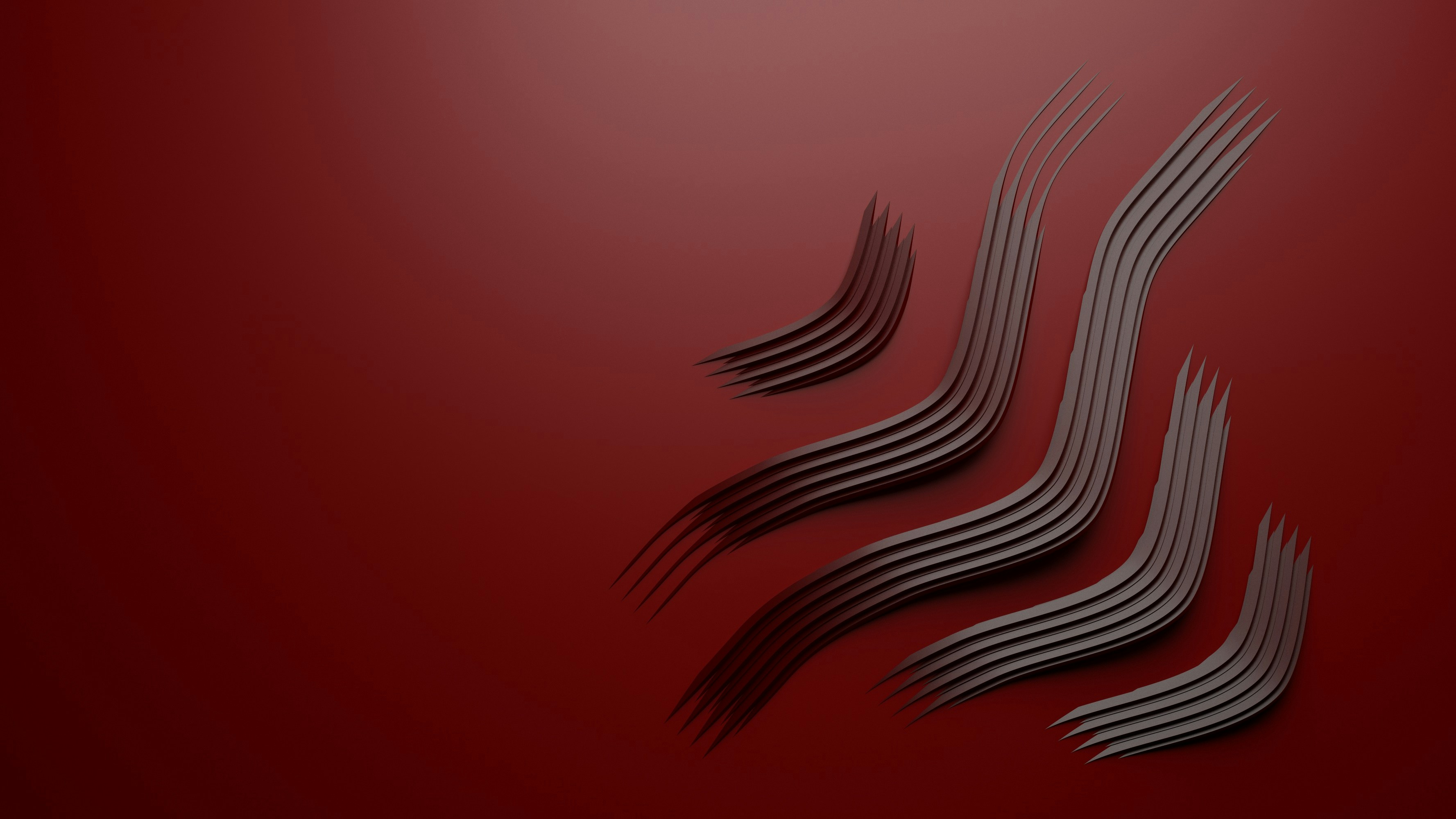 un primo piano di un oggetto metallico su sfondo rosso