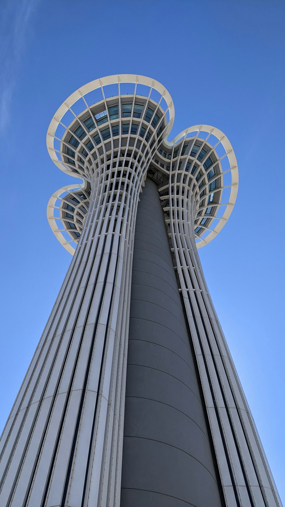 the top of a tall building with a sky background