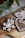 Close-up of beautifully decorated sugar cookies arranged on a rustic wooden board.