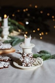 A winter candle featuring snowflake patterns.