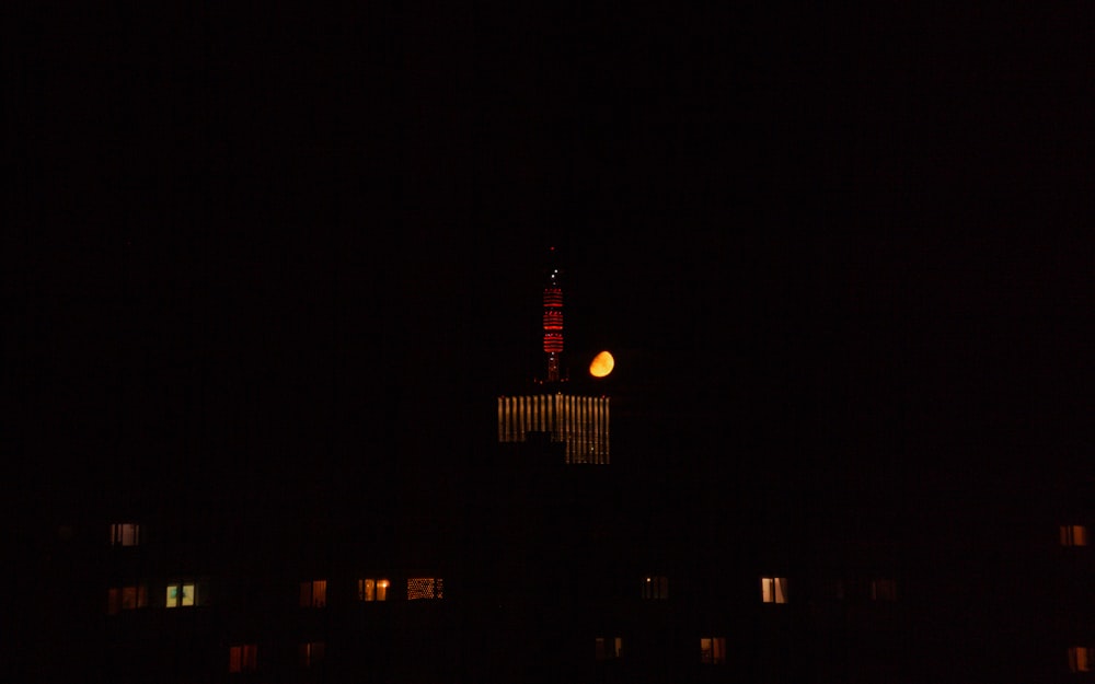 a building with a clock tower lit up at night