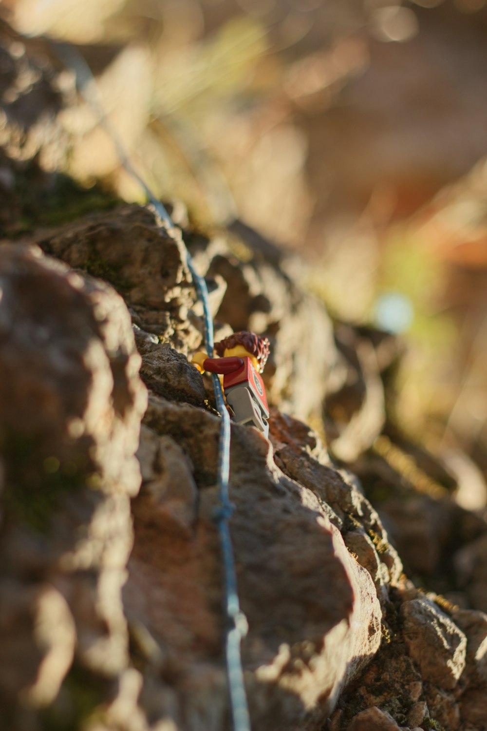 a man climbing up the side of a mountain