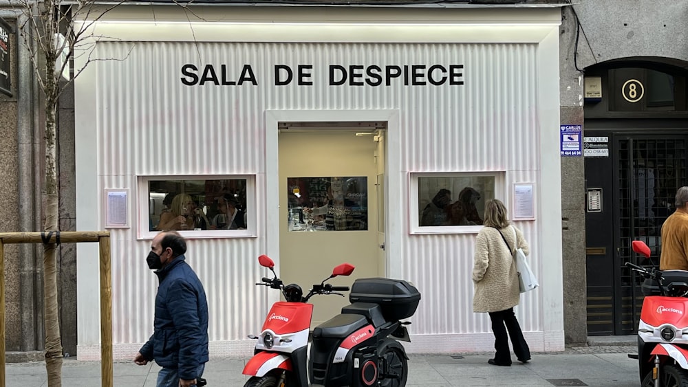 a couple of scooters parked in front of a building